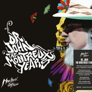 Album cover for Dr. John, The Montreux Years, CD: Dr. John in profile with a feathered hat next to a yellow skull. Stylized white text on the left; a sticker highlights the contents of the Dr. John, The Montreux Years, CD album.