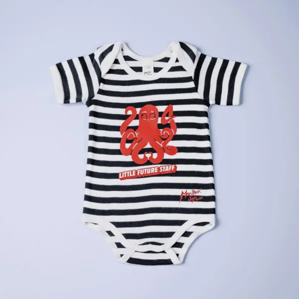 The Body Baby Little Future Staff onesie features black and white stripes, short sleeves, a red cartoon octopus, and "LITTLE FUTURE STAFF" printed on the front.