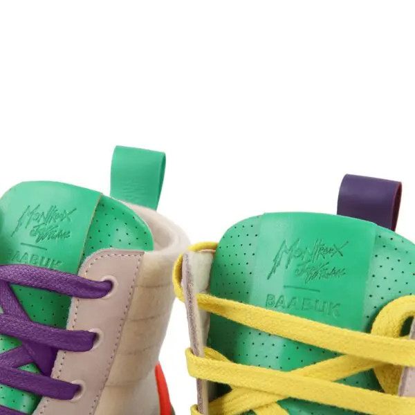 Gros plan sur deux Basket Lakeside Wooler by Baabuk, Édition limitée avec languettes vertes, lacets violets ou jaunes et logos du Montreux Jazz Festival sur les languettes.